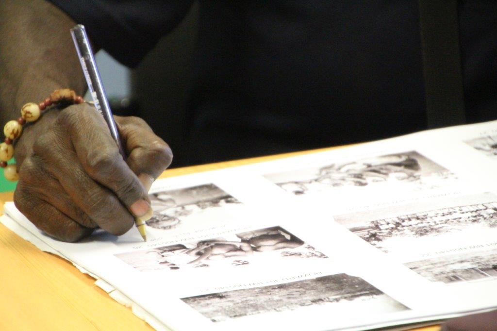 Jessica Bangu's hand writing on page with historic photos.